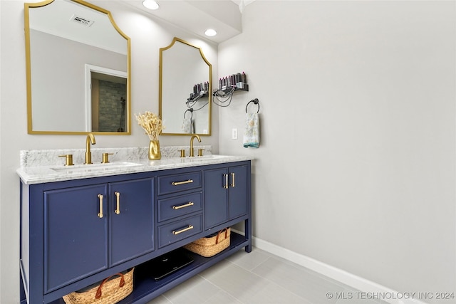 bathroom featuring tile patterned floors and vanity