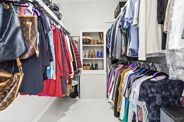 walk in closet featuring light tile patterned floors