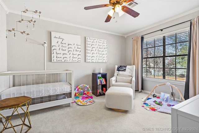 carpeted bedroom with ceiling fan and ornamental molding