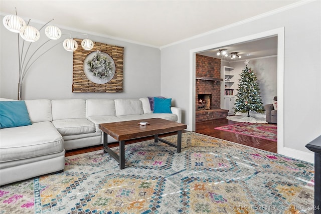 living room with a fireplace, dark hardwood / wood-style flooring, and ornamental molding