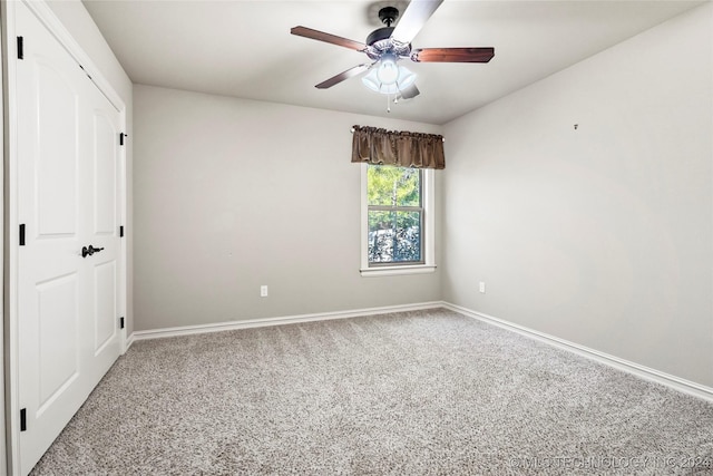 unfurnished bedroom featuring carpet and ceiling fan