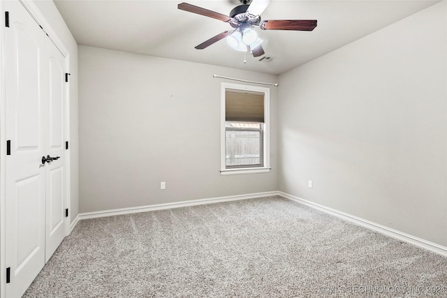 unfurnished bedroom with ceiling fan, carpet floors, and a closet