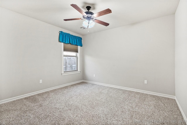 carpeted empty room with ceiling fan