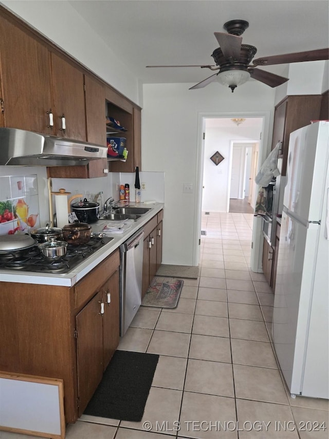 kitchen featuring ceiling fan, sink, light tile patterned floors, and appliances with stainless steel finishes