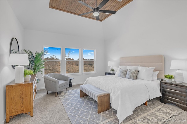 bedroom with carpet flooring, ceiling fan, wood ceiling, and baseboards