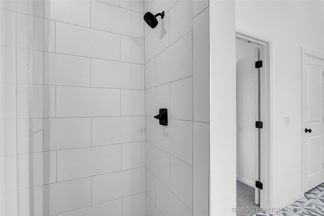 bathroom with a tile shower