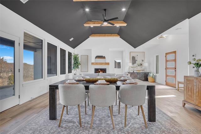 dining room featuring light hardwood / wood-style floors, ceiling fan, and lofted ceiling