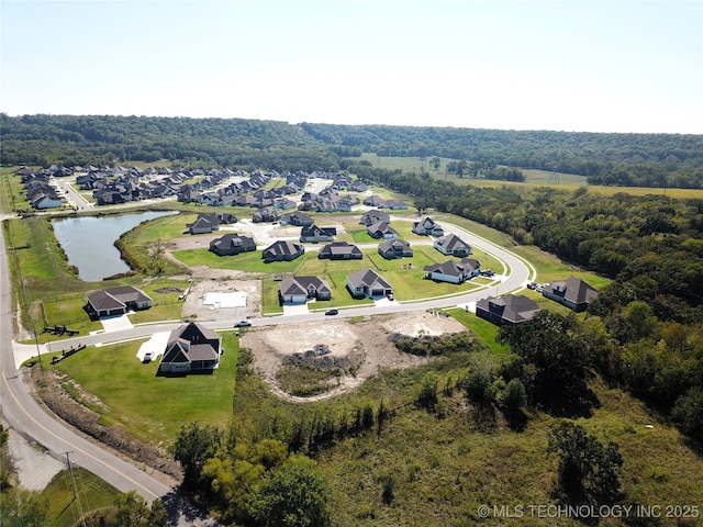 birds eye view of property featuring a residential view and a water view