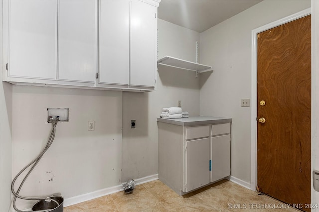 washroom featuring hookup for an electric dryer, cabinets, and hookup for a washing machine