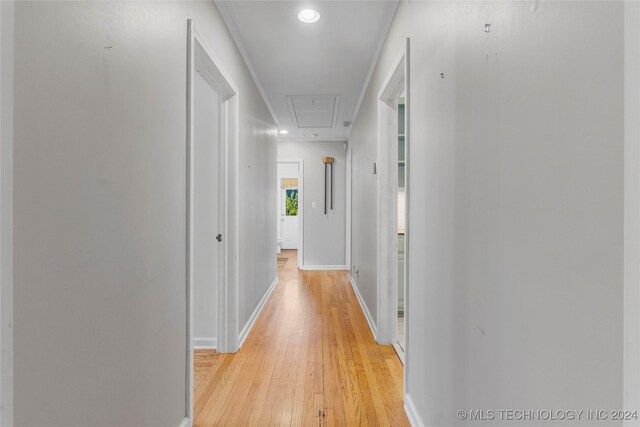 hall with light hardwood / wood-style floors