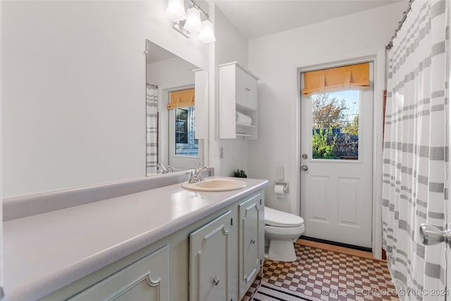 bathroom with vanity and toilet