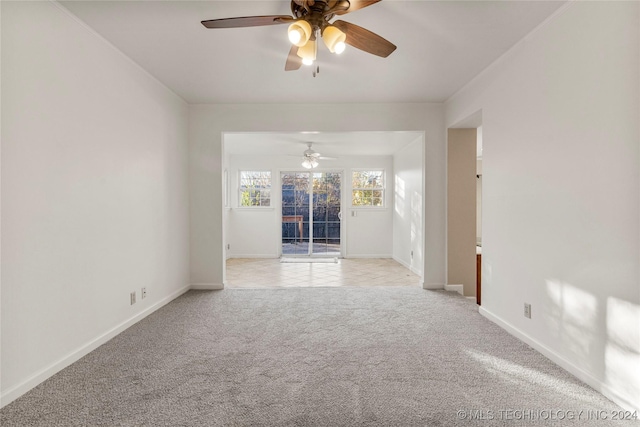 empty room with light carpet and ceiling fan