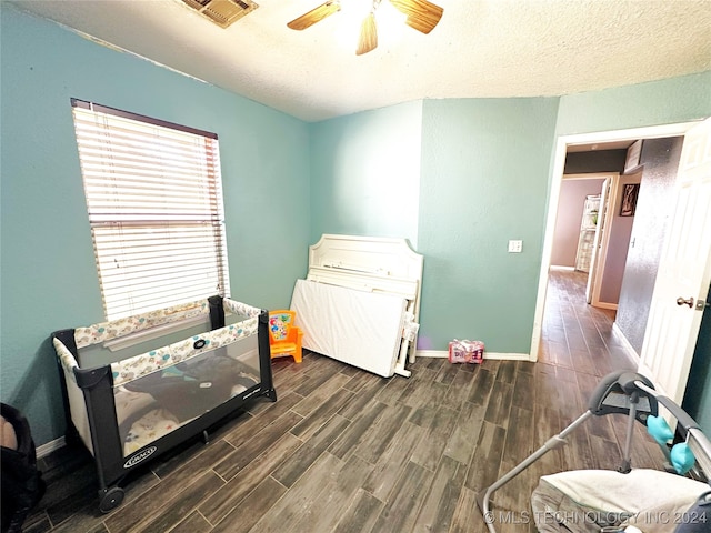 76 N Greer, Eufaula, OK 74432 - bedroom featuring wood finished floors, baseboards, a textured ceiling, and a ceiling fan