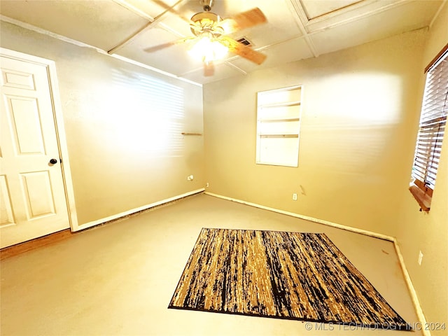 76 N Greer, Eufaula, OK 74432 - spare room with a ceiling fan, finished concrete flooring, attic access, and baseboards