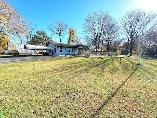 view of yard featuring a carport