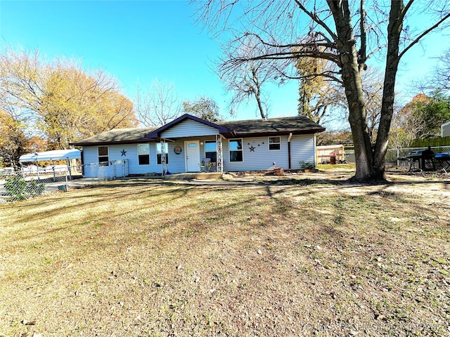 back of property featuring a yard