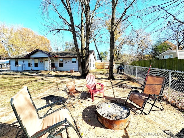 view of patio / terrace featuring a fire pit