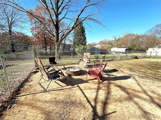 76 N Greer, Eufaula, OK 74432 - fenced backyard with an outdoor fire pit