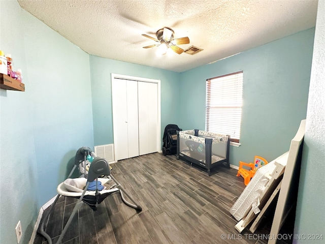 76 N Greer, Eufaula, OK 74432 - miscellaneous room with wood finished floors, baseboards, a ceiling fan, and a textured ceiling