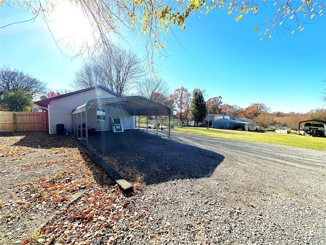 view of side of home featuring a carport