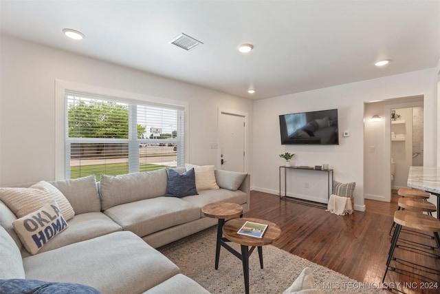 living room featuring dark hardwood / wood-style floors