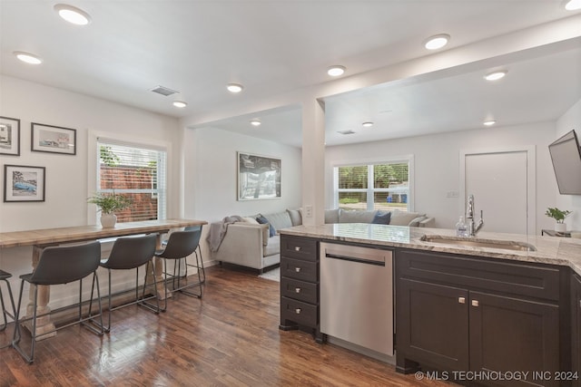 kitchen with dark hardwood / wood-style flooring, a healthy amount of sunlight, sink, and stainless steel dishwasher