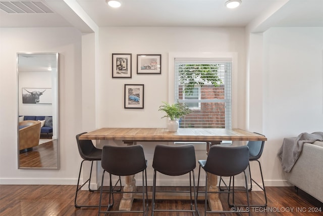 dining room featuring dark hardwood / wood-style flooring