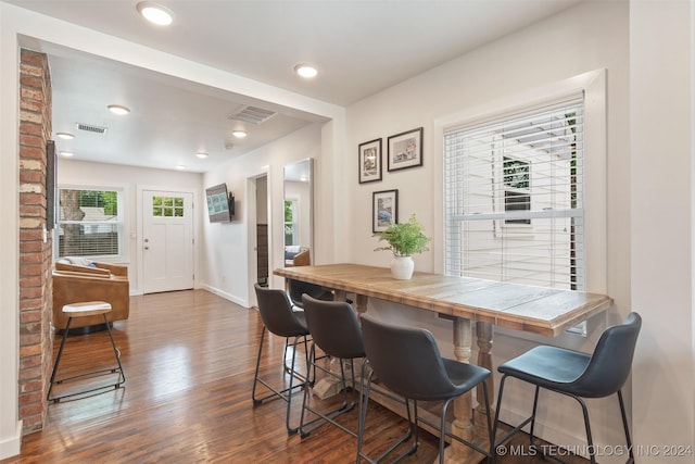 dining space featuring dark hardwood / wood-style floors