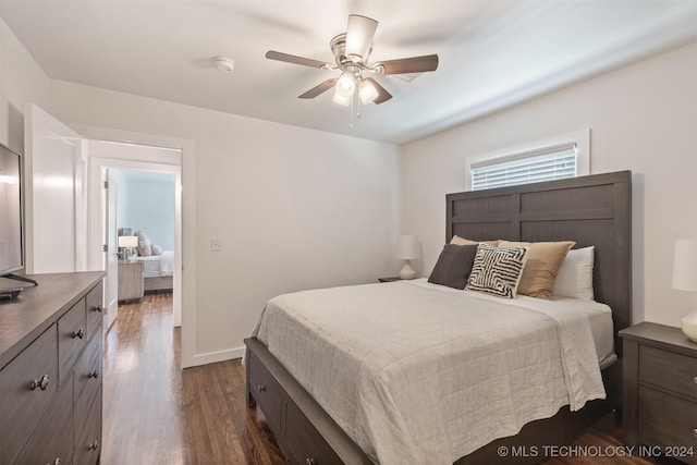 bedroom with ceiling fan and dark wood-type flooring