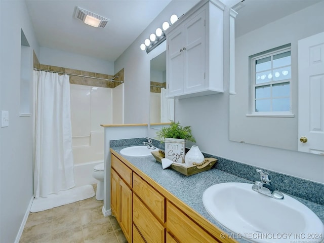 full bathroom featuring vanity, toilet, and shower / tub combo with curtain