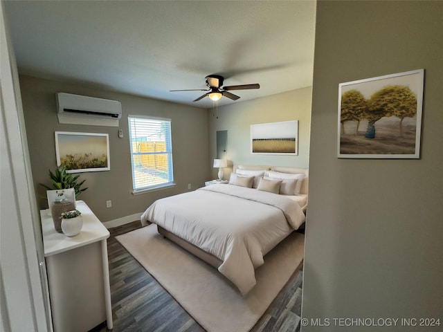 bedroom featuring ceiling fan, dark hardwood / wood-style flooring, and a wall unit AC