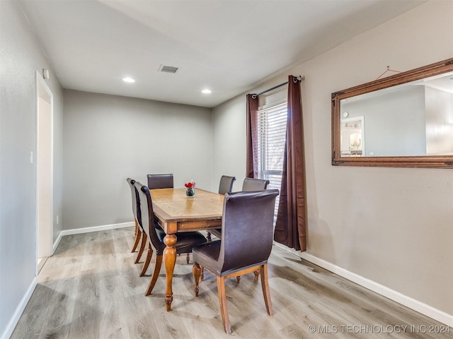 dining space with light wood-type flooring