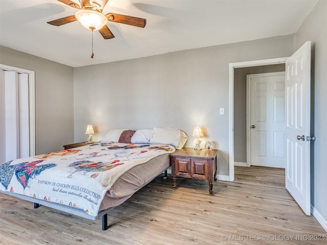 bedroom with ceiling fan and light hardwood / wood-style floors