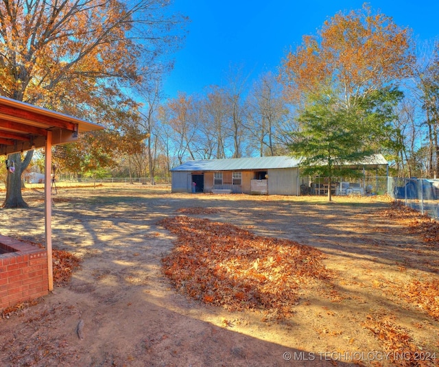 view of front of house featuring an outbuilding