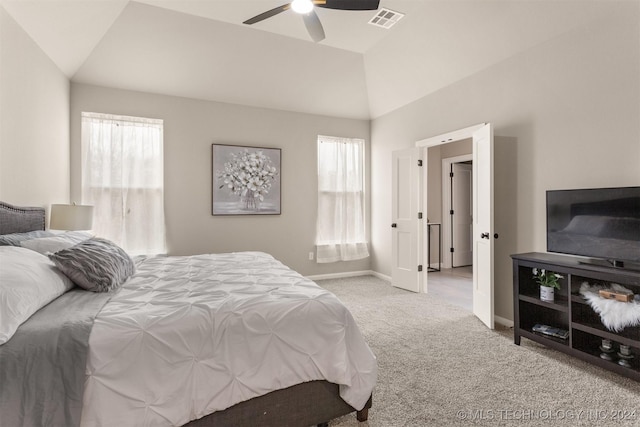 bedroom with light colored carpet, ceiling fan, and lofted ceiling