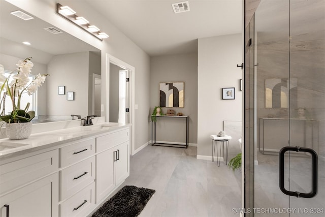 bathroom with vanity, a shower with door, and lofted ceiling