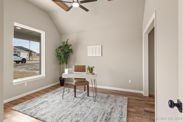 home office with ceiling fan, dark hardwood / wood-style flooring, and vaulted ceiling