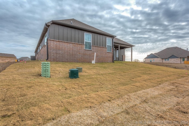 view of property exterior featuring a yard