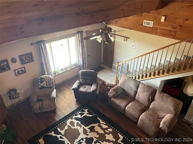 living room with hardwood / wood-style floors, lofted ceiling with beams, ceiling fan, and wood ceiling