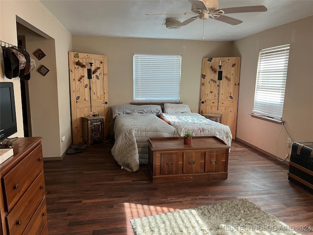 bedroom featuring dark wood-style floors and a ceiling fan