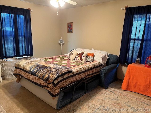 bedroom with carpet floors and a ceiling fan