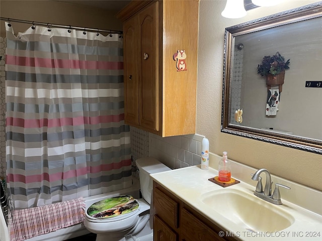 bathroom with a shower with shower curtain, vanity, backsplash, and toilet