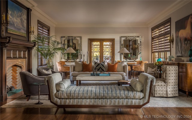 sitting room featuring crown molding, french doors, and hardwood / wood-style flooring