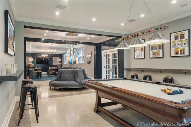 game room featuring french doors, a notable chandelier, ornamental molding, and billiards