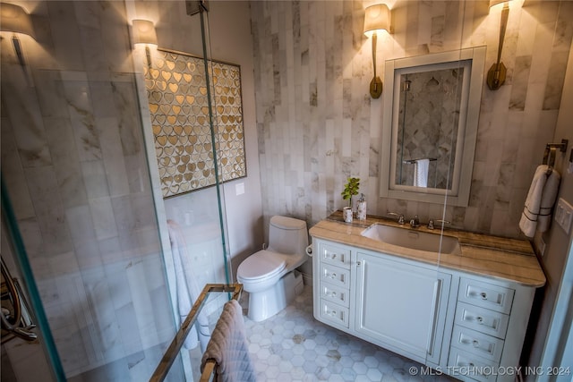 bathroom featuring vanity, toilet, and walk in shower