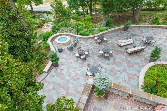 view of patio featuring an outdoor fire pit