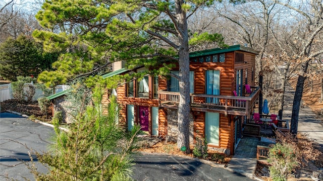 view of log cabin