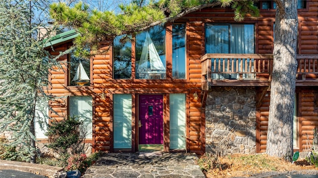 doorway to property with a balcony