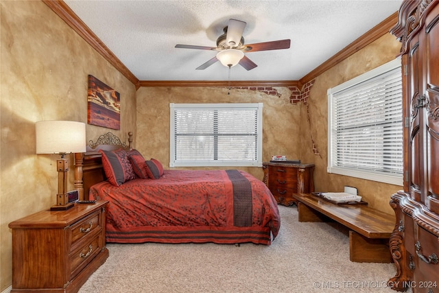 carpeted bedroom with a textured ceiling, multiple windows, ornamental molding, and ceiling fan