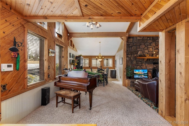 misc room featuring vaulted ceiling with beams, wood walls, a chandelier, and light carpet